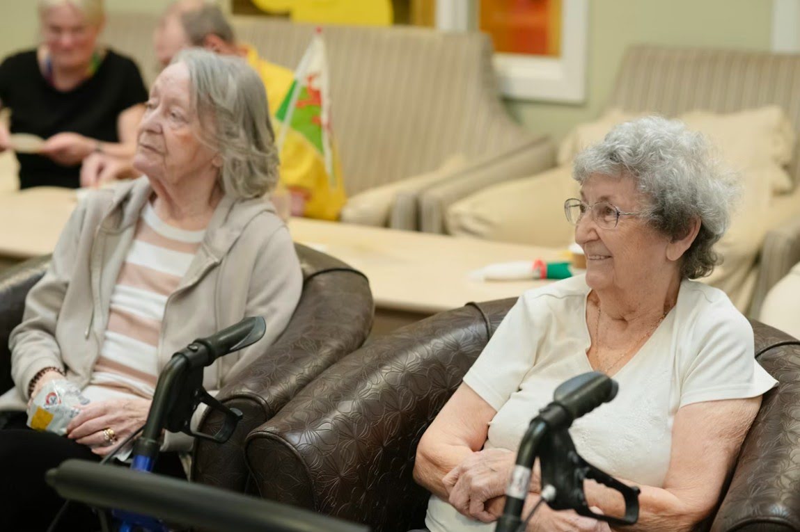 Seniors seated together in a care setting receiving compassionate home care support near Schaumburg, IL
